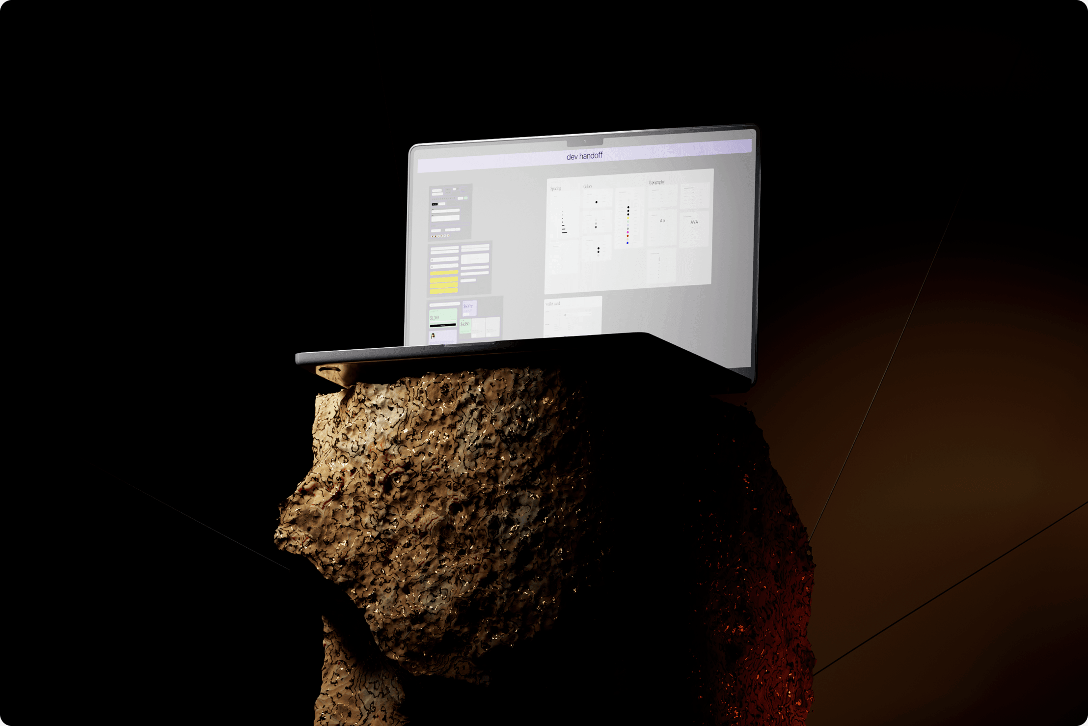 Developer handoff file on a laptop balanced on a rough stone