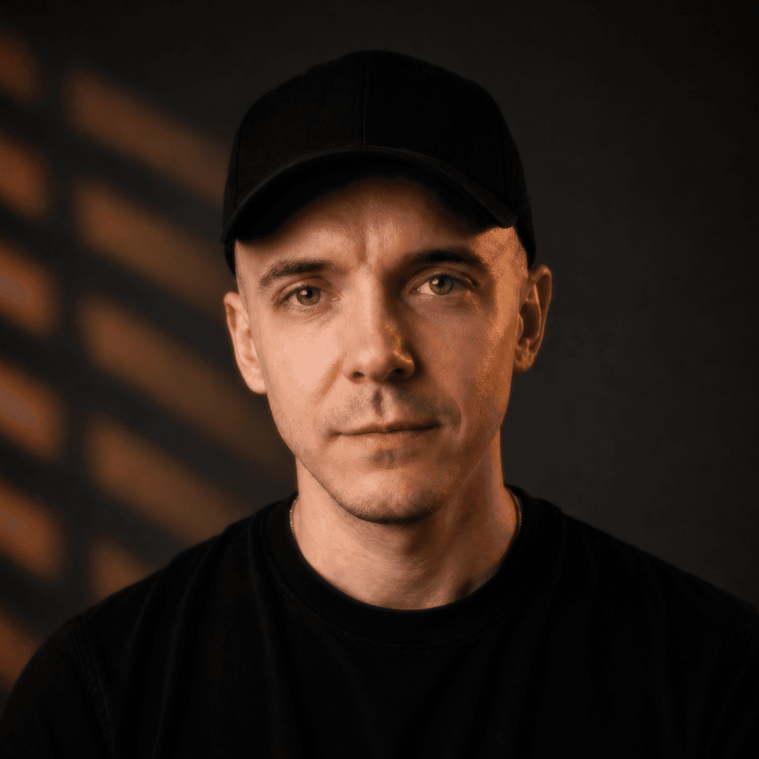 Portrait of Artem Melnikov in a black cap and T-shirt